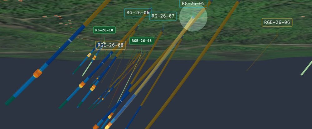 Vantage Core 3-D view — drill traces coloured by grade beneath the survey surface